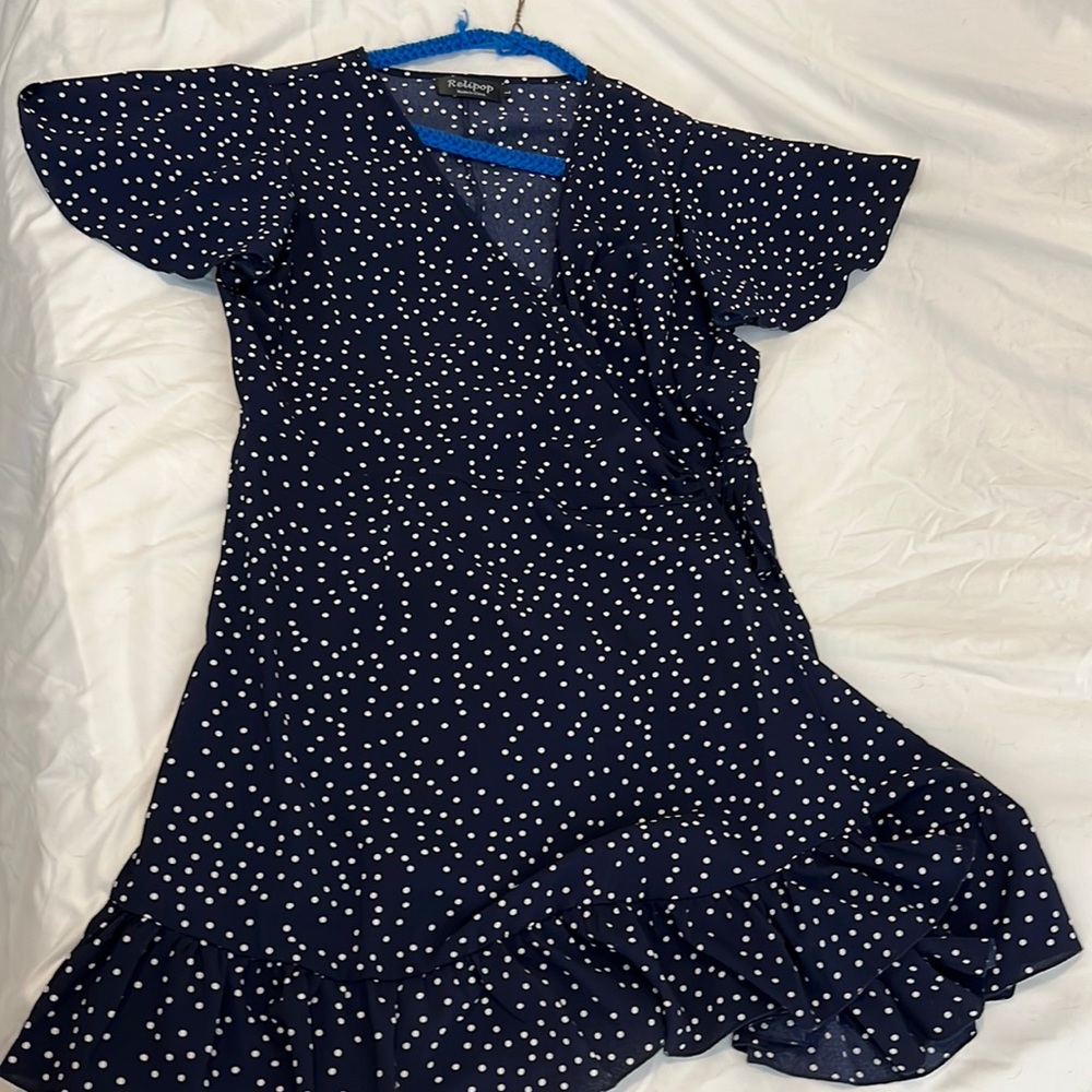 Mini wrap dress in navy with white polka dots. Size L.